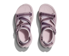 Pair of pink sandals with purple straps on a white background
