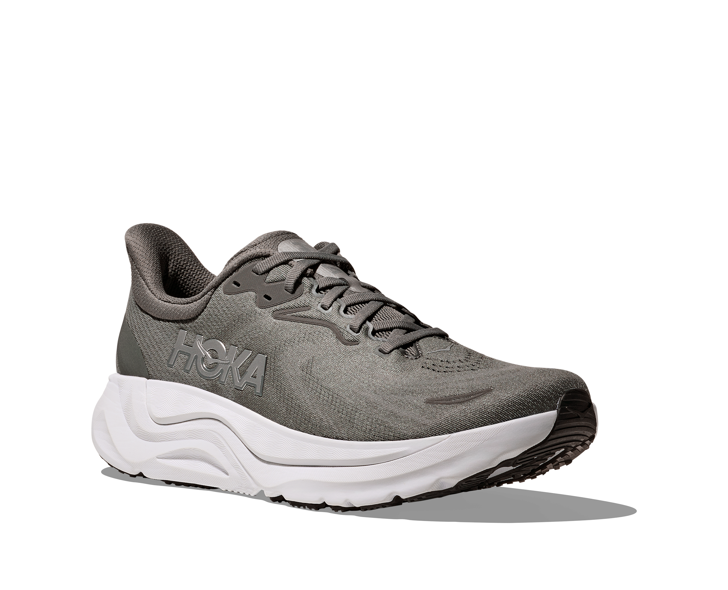 Gray running shoe with white sole on a white background