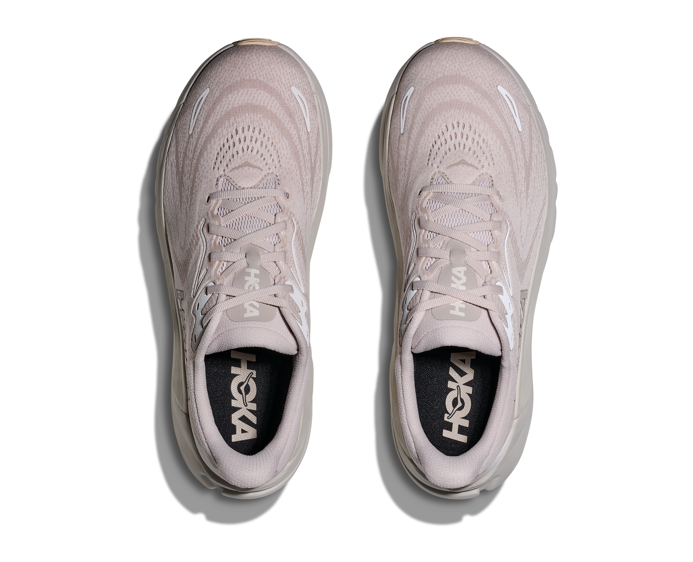 Pair of light gray running shoes with 'Hoka' branding on a white background