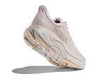 Pink running shoe with white sole on a white background