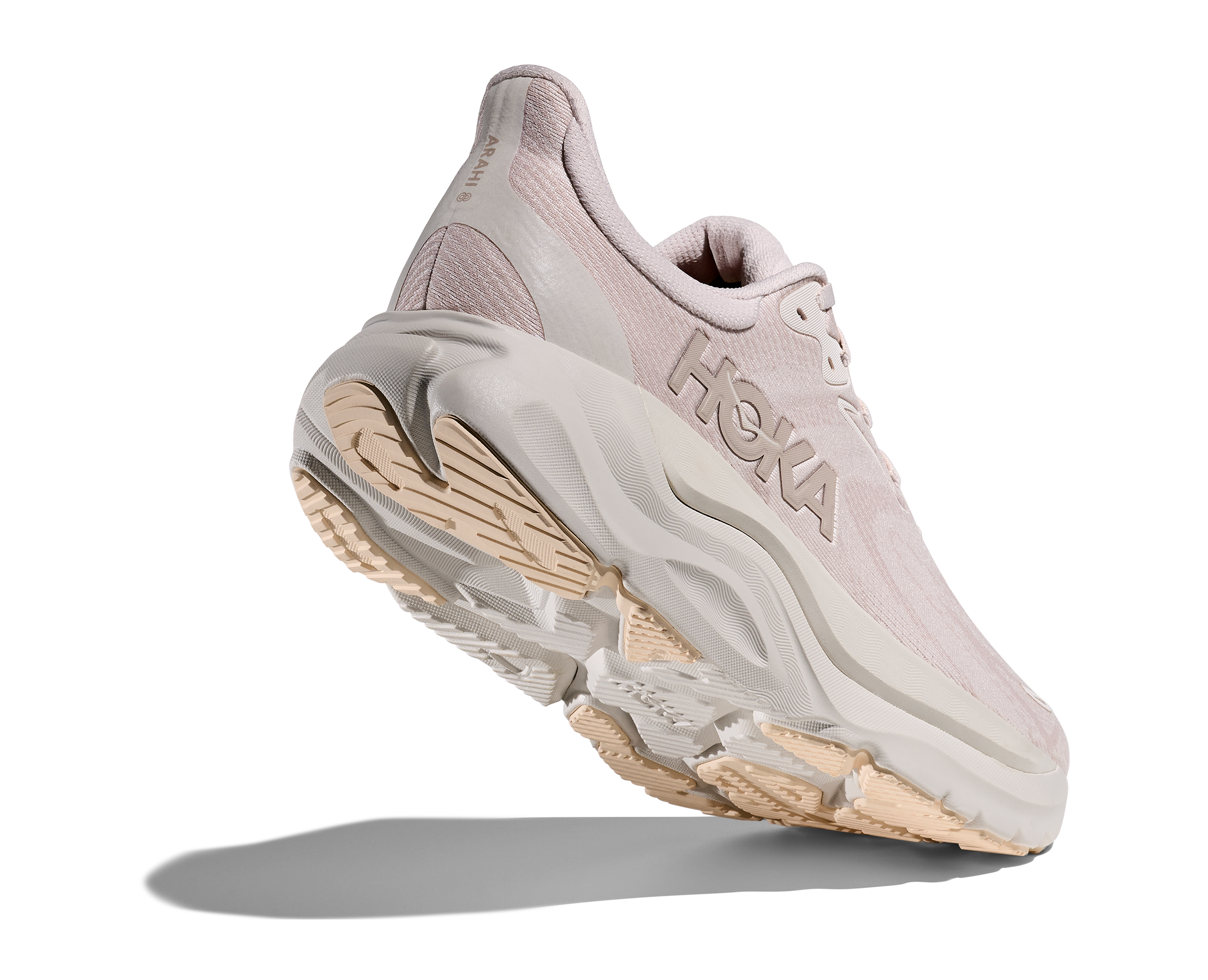 Pink running shoe with white sole on a white background