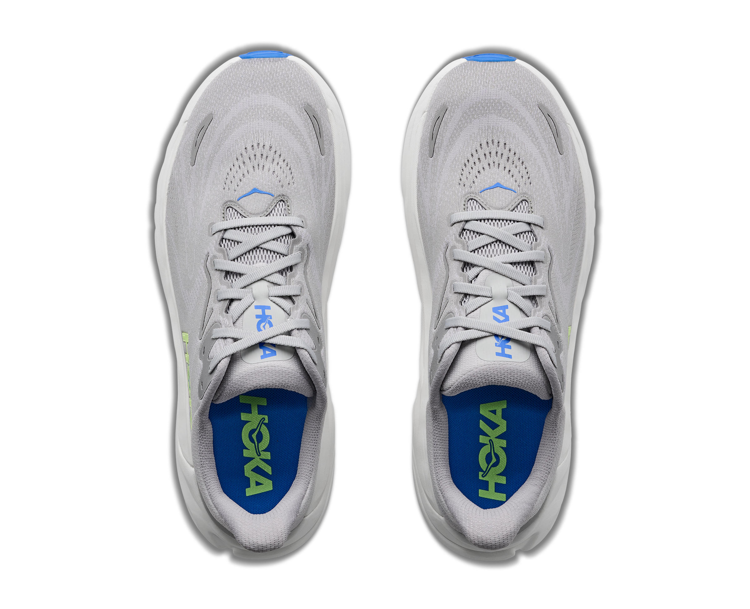 Pair of gray running shoes with blue soles on a white background