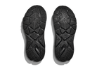 Black shoe soles with tread pattern on a white background