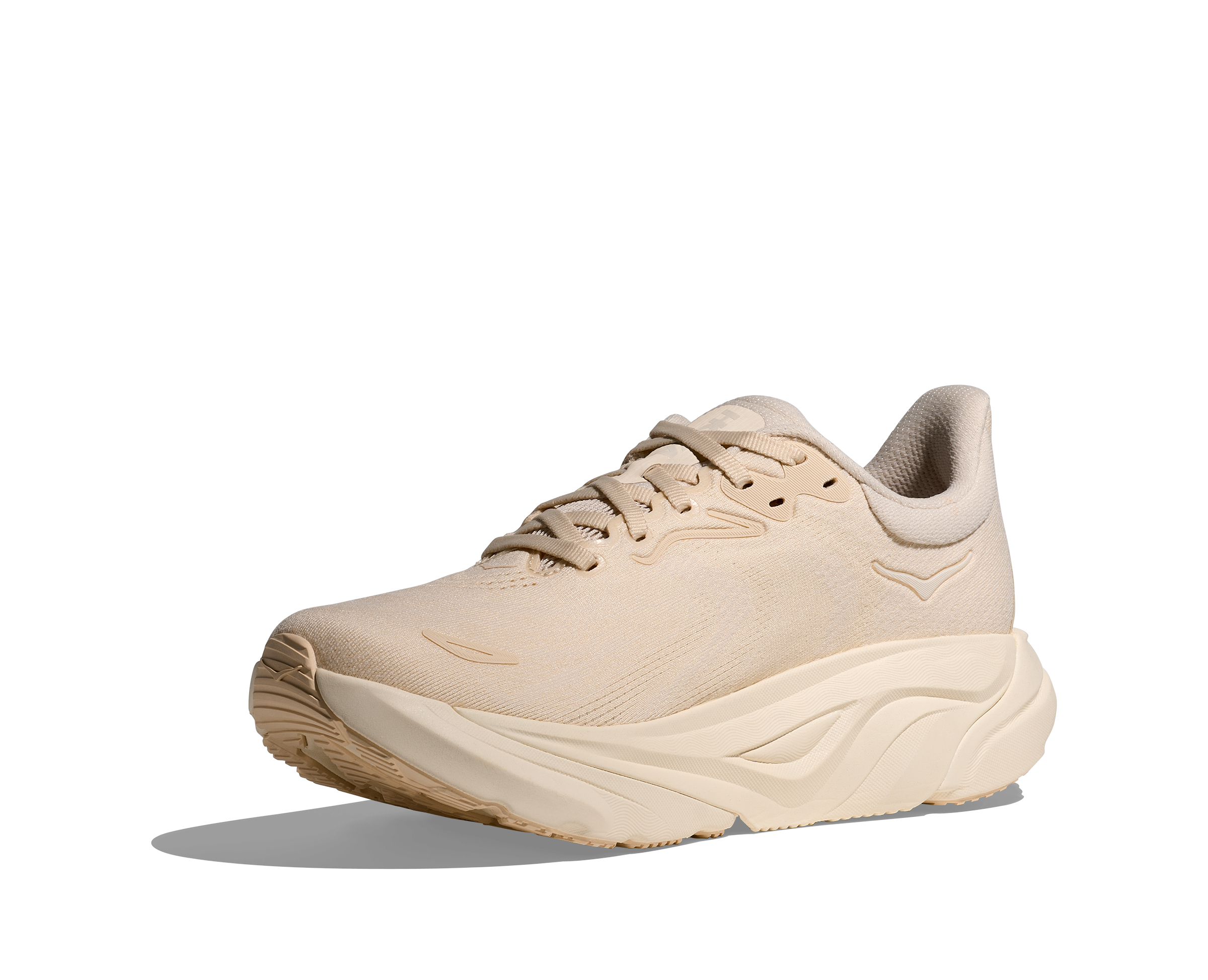 Beige running shoe on a white background