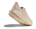 Beige running shoe with 'Hoka' branding on a white background