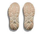 Beige shoe soles with tread pattern on a white background