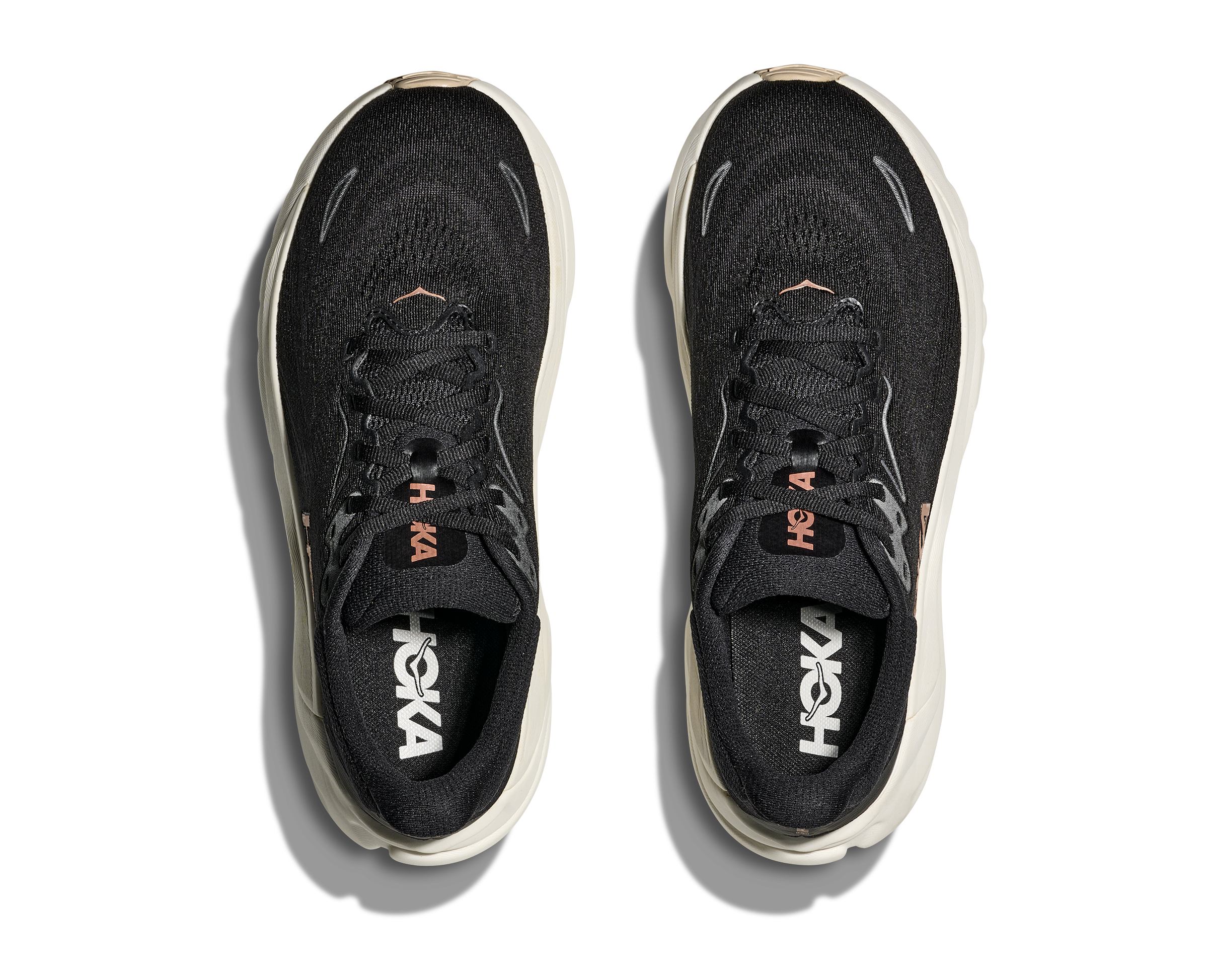 Black Hoka running shoes on a white background