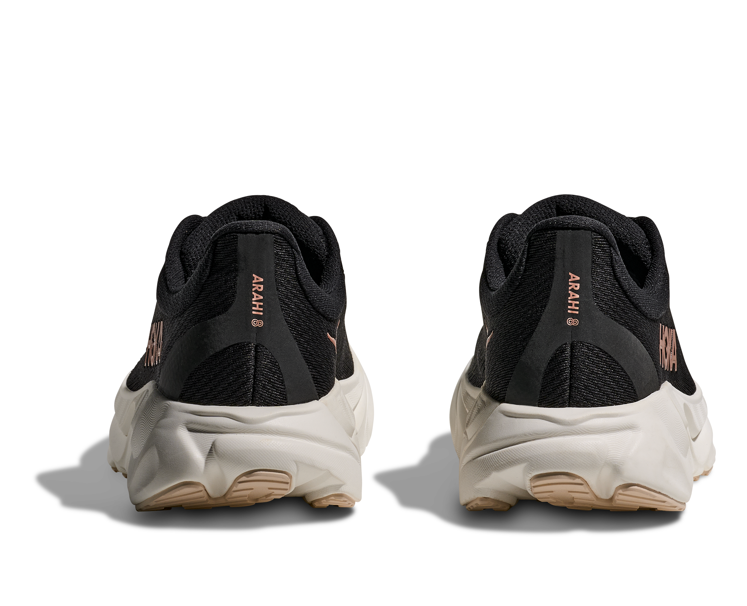 Black running shoes with white soles on a white background