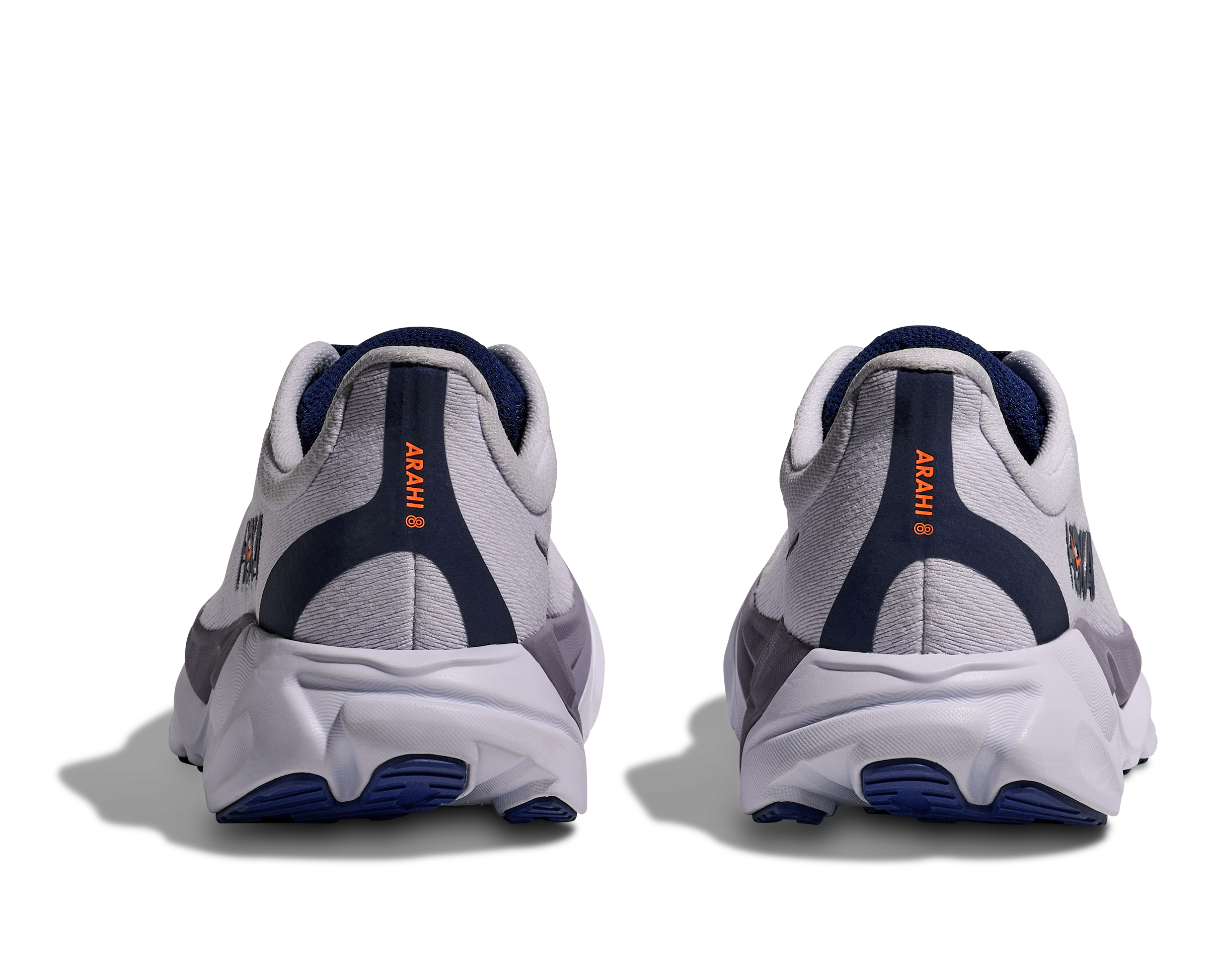 White and blue running shoes with orange branding on a white background