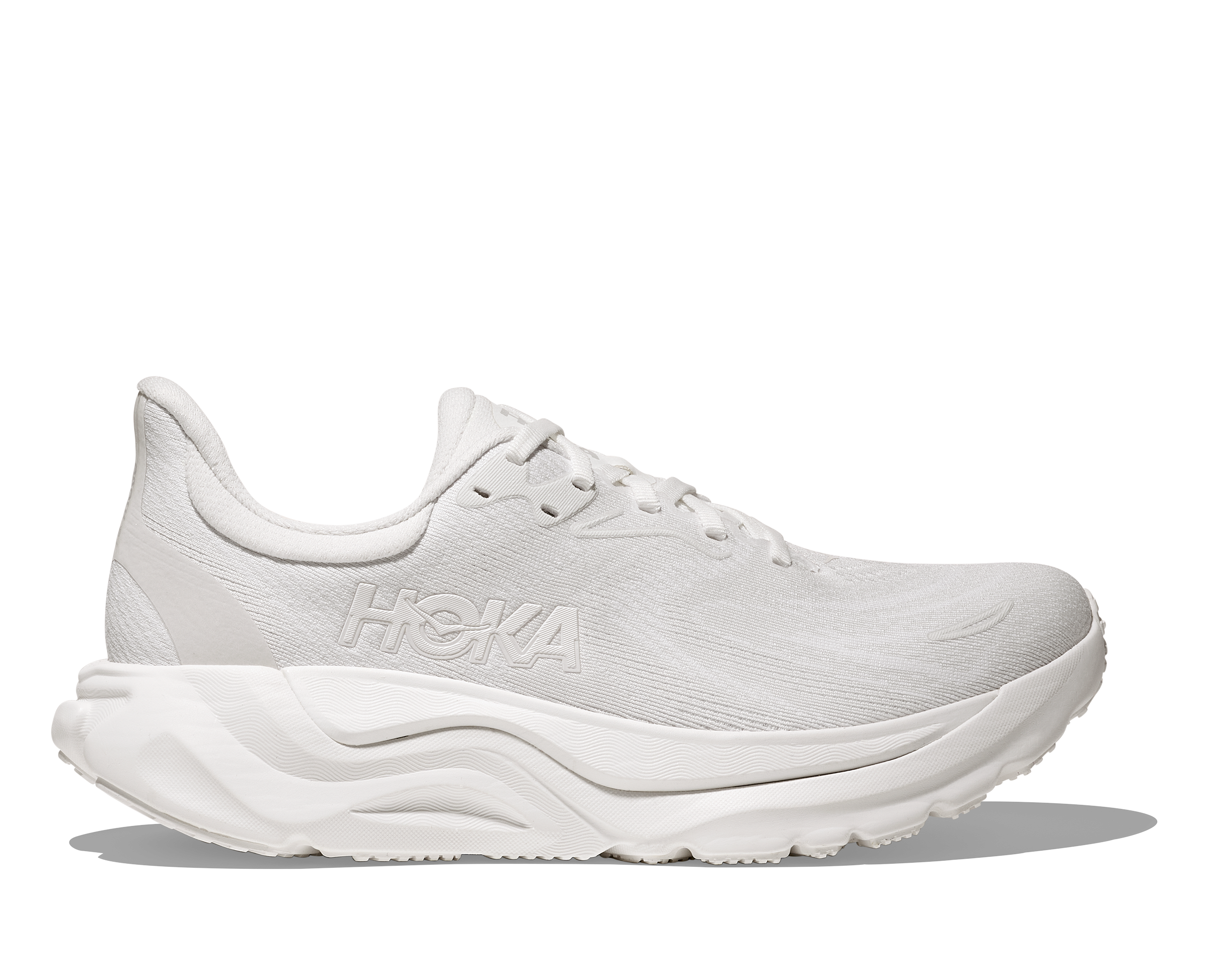 White running shoe with 'Hoka' branding on a white background