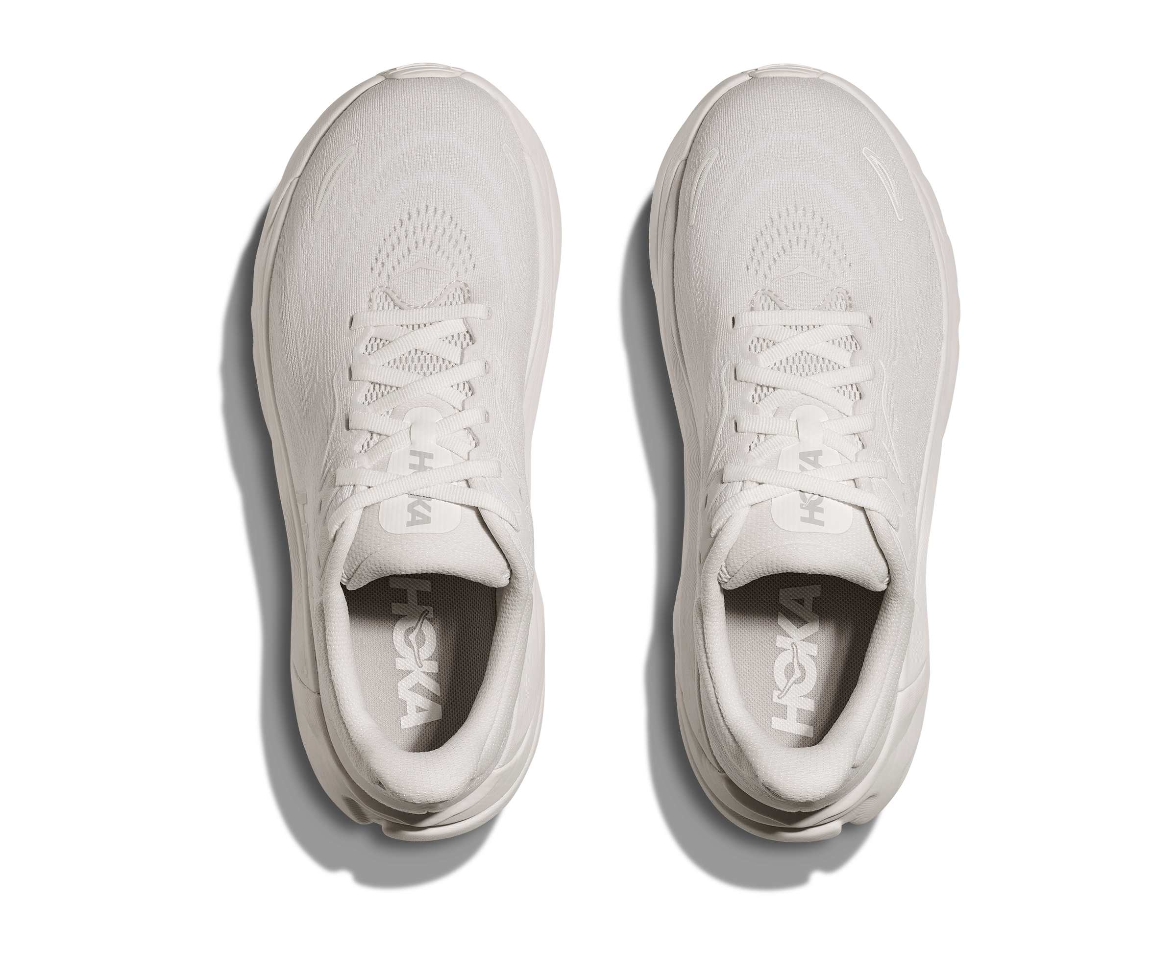 Pair of white sneakers on a white background