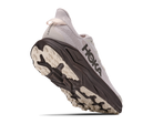 Hoka running shoe with sole facing up on a white background