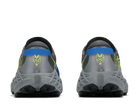 Gray athletic shoes with blue and green accents on a white background