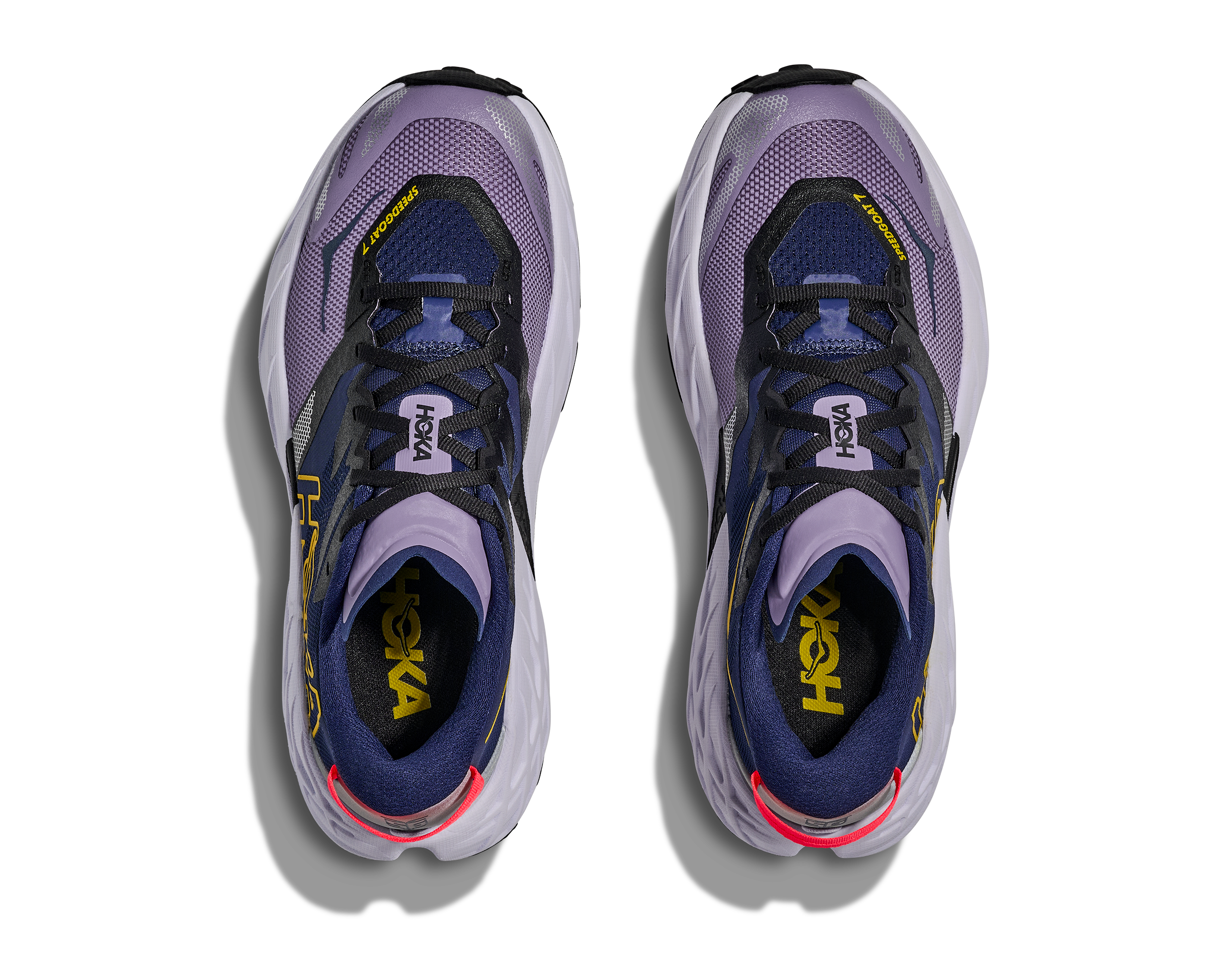 Pair of purple and black running shoes with visible brand logo on a white background