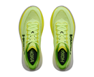 Pair of neon green running shoes with 'Hoka' branding on a white background