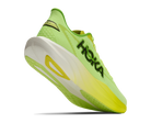 Bright green running shoe with white sole on a white background