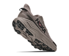Gray running shoe with black sole on a white background