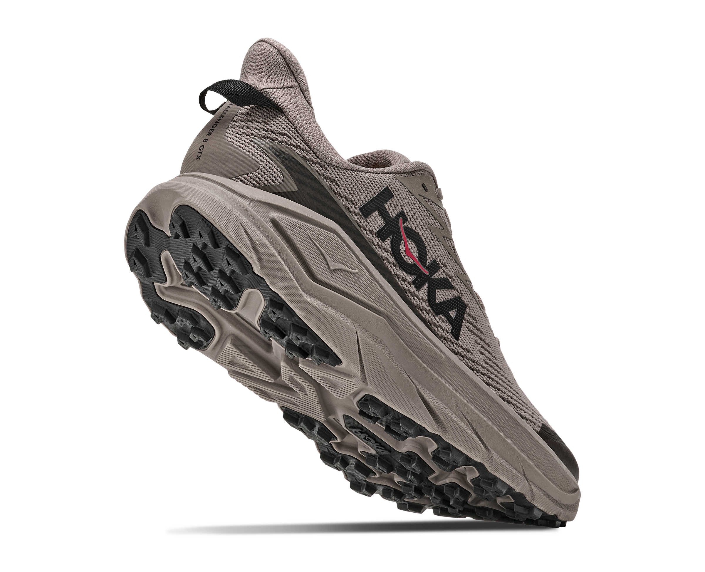 Gray running shoe with black sole on a white background
