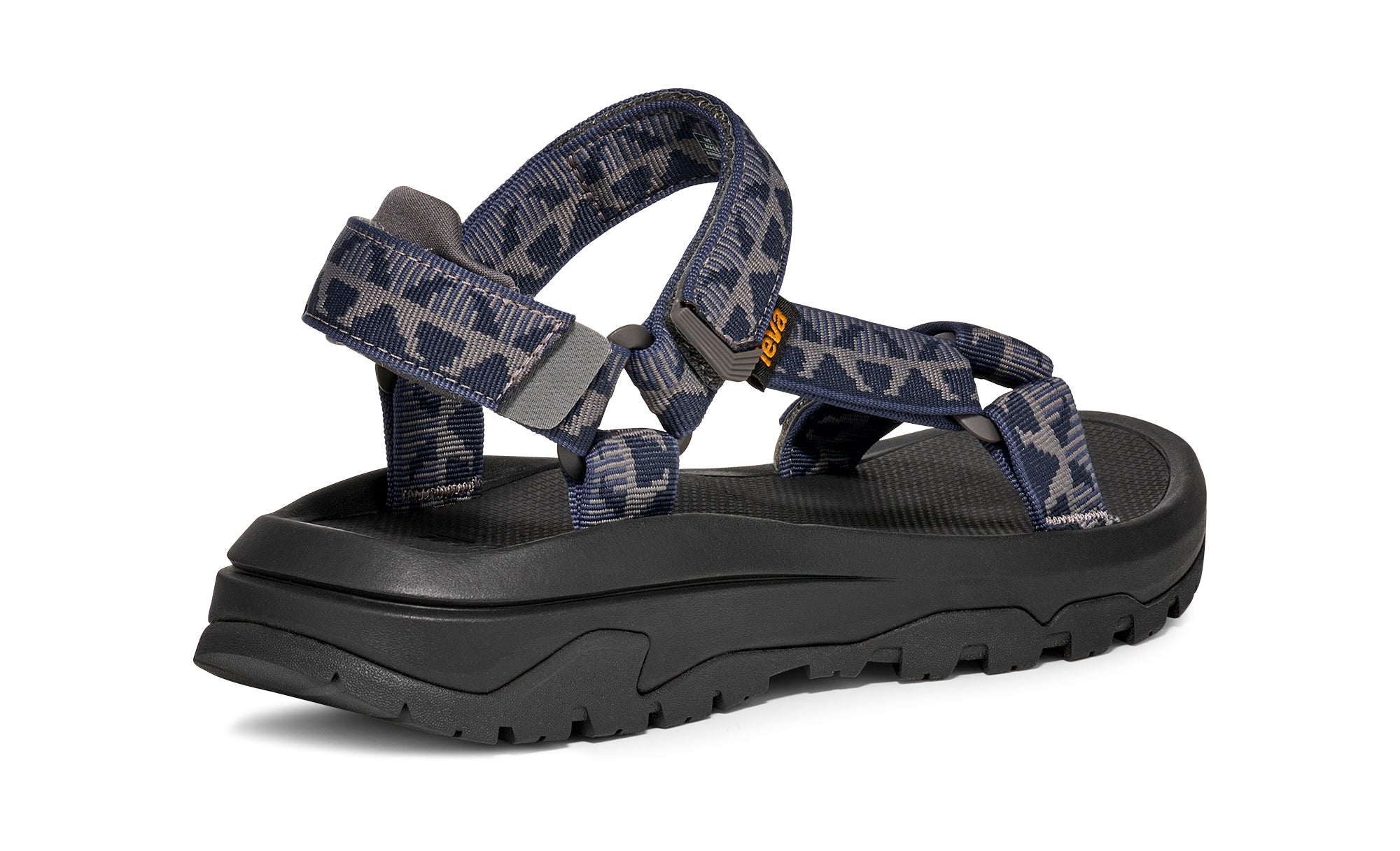 Blue patterned sandal with black sole on a white background