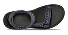 Black sandal with blue patterned straps on a white background