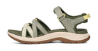 Green sandal with brown sole on a white background
