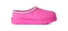 A single UGG slip-on clog shoe in bright pink suede with a textured pink sole and a patterned pink and white knit trim around the collar, shown against a plain white background.