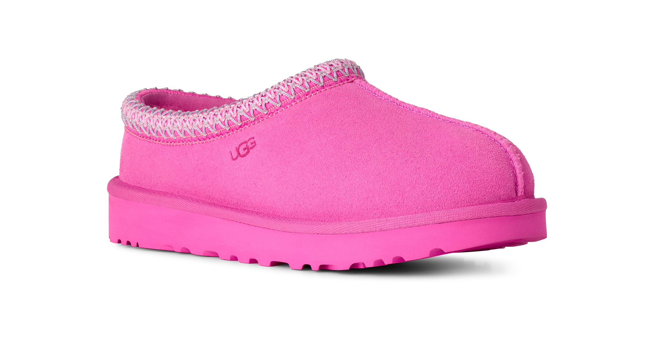 A single UGG slip-on clog shoe in bright pink suede with a matching pink sole and a pink and white patterned trim around the collar, shown on a plain white background.