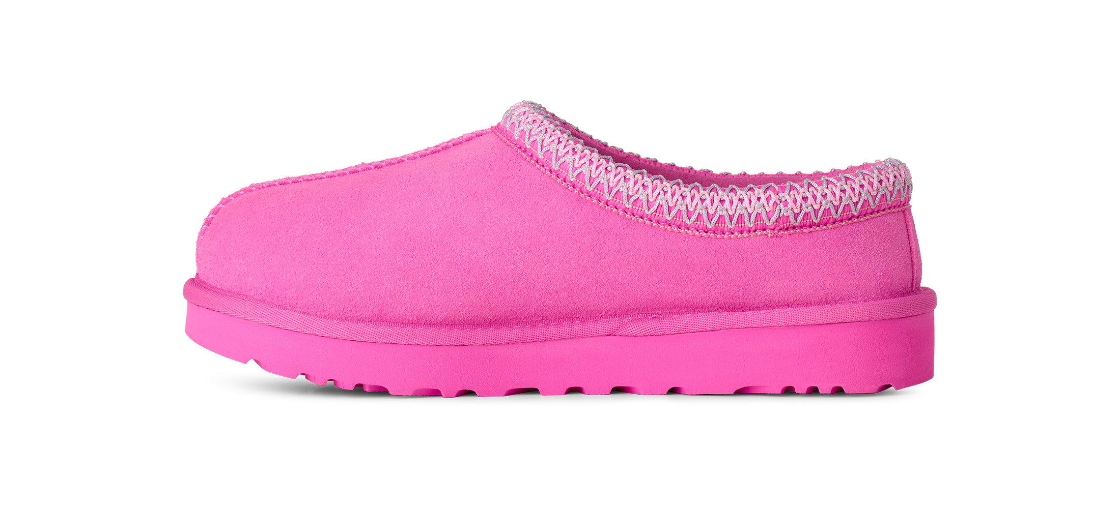 A single bright pink slip-on clog-style shoe with a textured knit trim around the opening and a matching thick sole, shown in side profile on a white background.