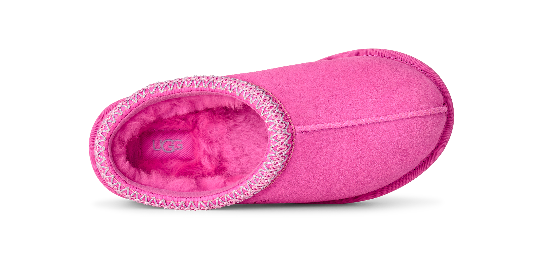 A bright pink slip-on slouchy bootie with a fuzzy pink interior and a decorative white stitched trim around the opening, shown from a side profile on a white background.