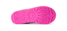 Bright pink shoe sole with a textured radial tread pattern, shown from the bottom against a white background.