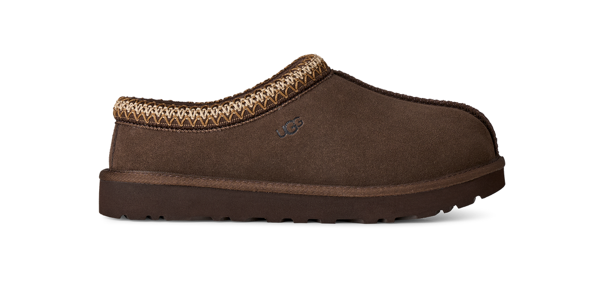 A single brown suede slipper with a textured brown and beige knit trim around the collar, shown in profile against a white background.