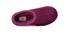 A single UGG slipper in a deep magenta-purple suede-like finish with a matching fuzzy interior and a visible UGG label inside, shown from a top-down angle on a white background.