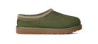 An olive green suede slipper with a tan knit trim and a brown sole, shown from a side profile on a white background.