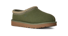 An olive green slip-on clog-style shoe with a tan woven trim around the collar and a brown sole, shown on a plain white background.