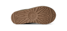 The textured brown rubber outsole of a shoe, photographed from directly underneath against a solid white background.