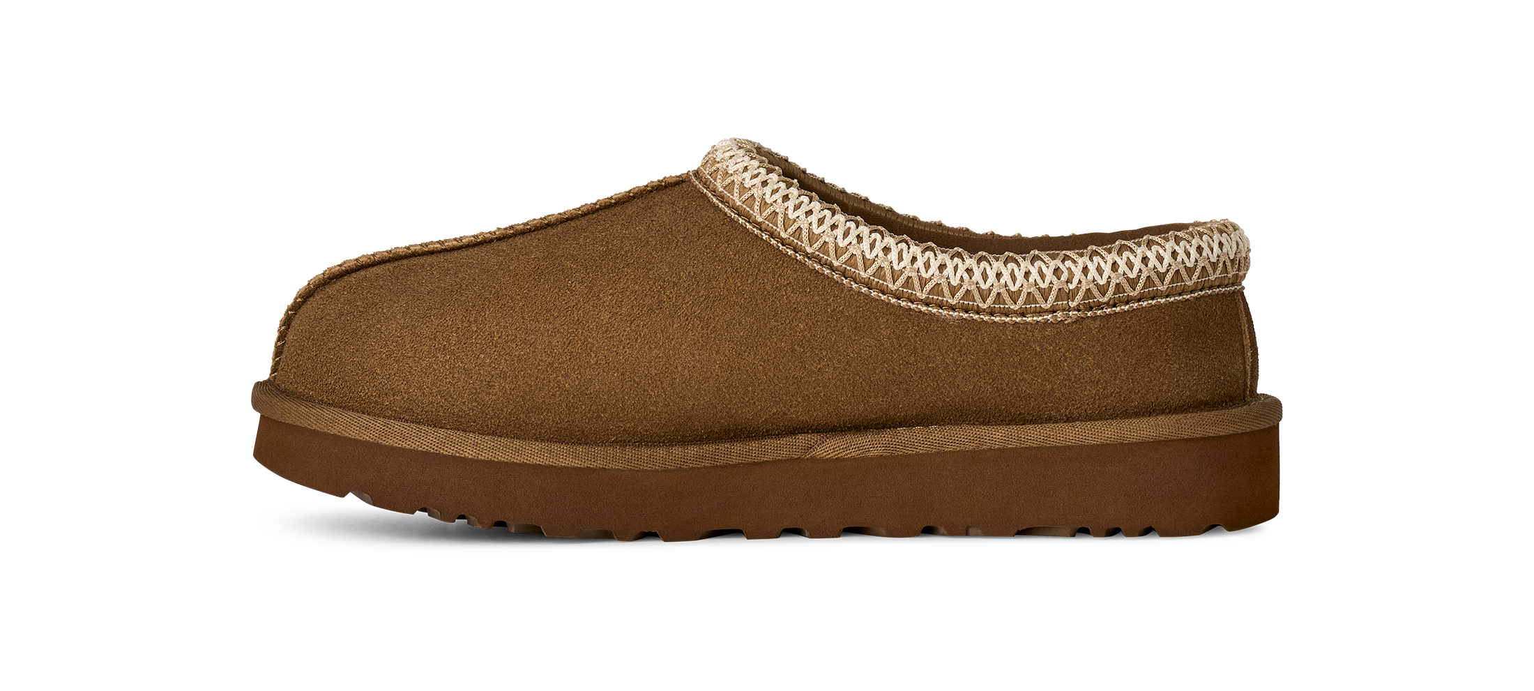 A single brown suede slipper with a textured cream knit trim around the collar and a thick brown sole, shown in profile against a white background.