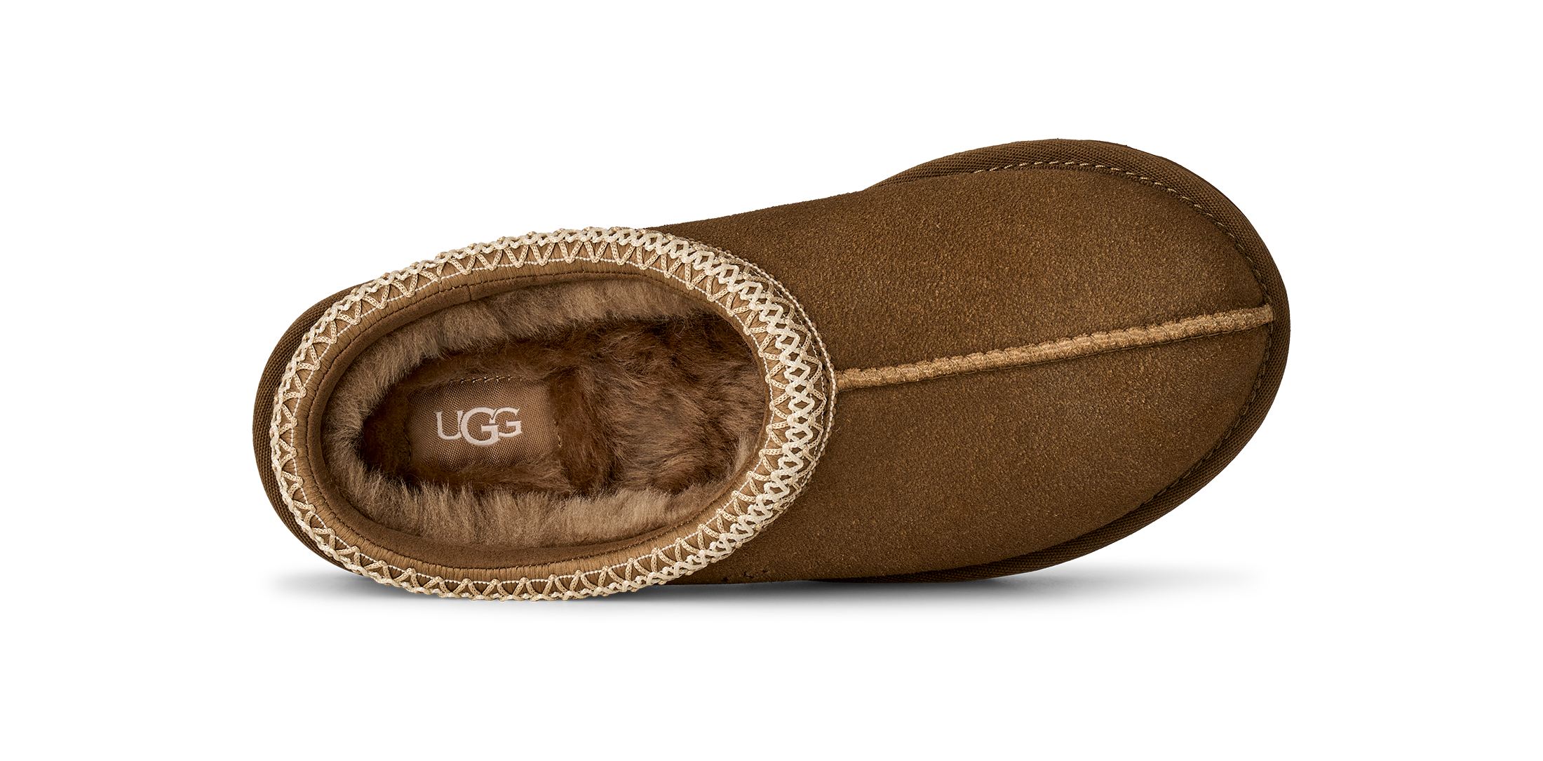 A single brown UGG slipper shown from a top-down view on a white background, featuring a textured beige trim around the opening and a soft brown faux-fur lining.