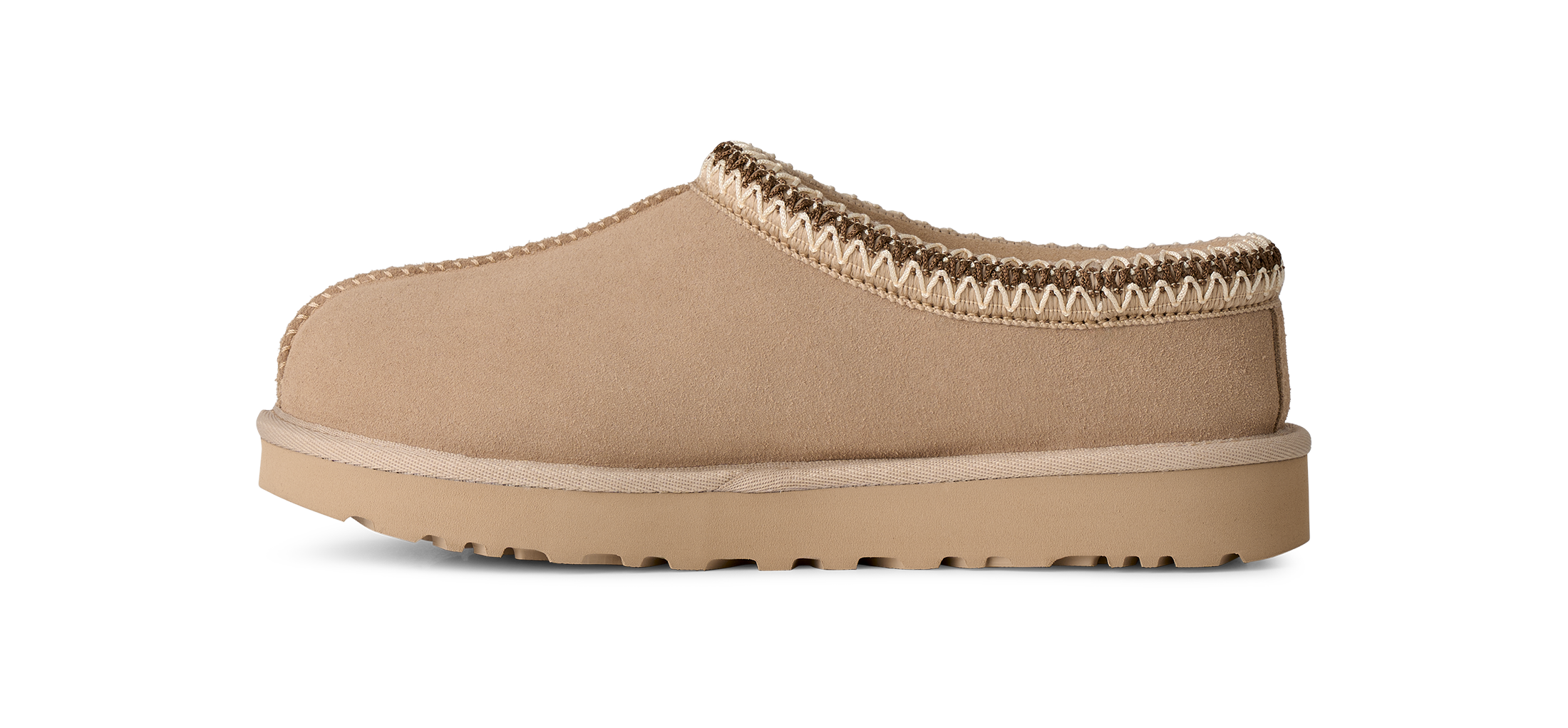 Tan slip-on shoe with a textured sole on a white background