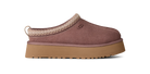 A single UGG slip-on clog shoe in dusty mauve-brown suede with a tan platform sole and a beige braided trim detail, shown from a side profile on a white background.
