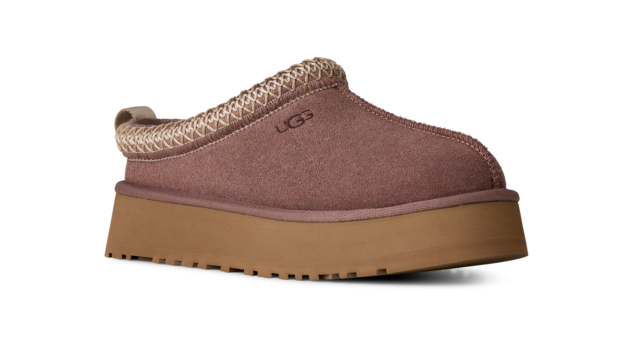 Brown slip-on shoe with a platform sole on a white background