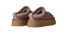 A pair of slip-on platform slippers in a dusty mauve-brown color, featuring a textured knit trim around the collar and a thick tan sole, shown against a plain white background.