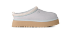 Light blue slip-on shoe with a beige sole on a white background