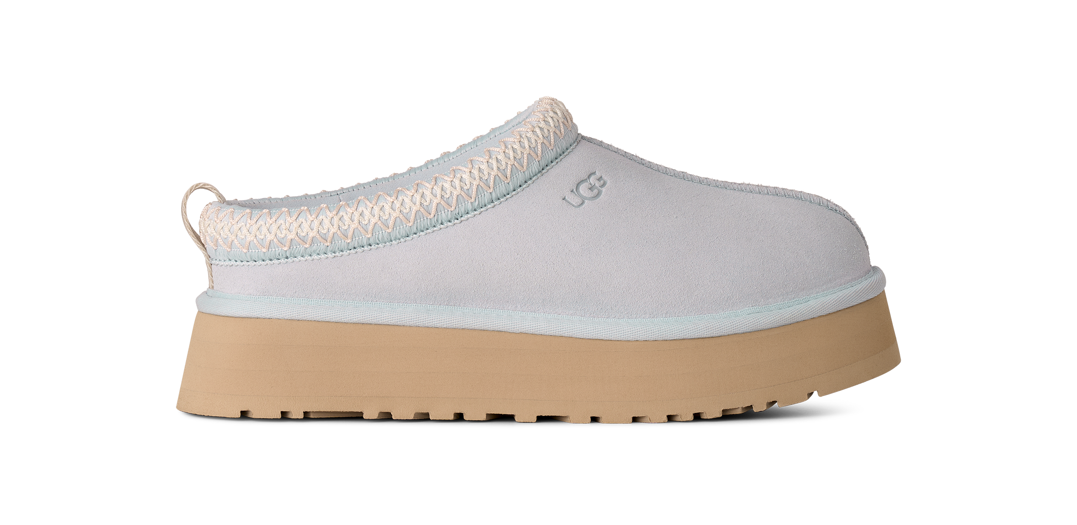 Light blue slip-on shoe with a beige sole on a white background