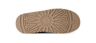 Close-up of a brown shoe sole with tread pattern on a white background