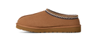 Brown slipper with decorative trim on a white background