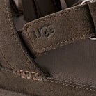 Close-up of a brown UGG boot with brand logo
