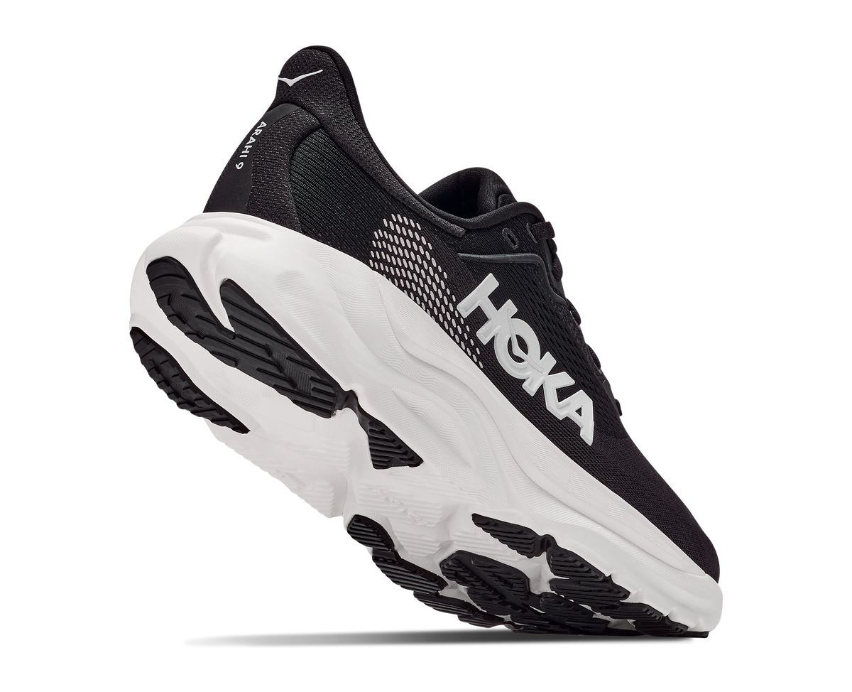 Black running shoe with white sole on a white background