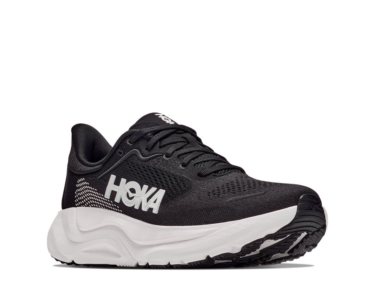 Black Hoka running shoe on a white background