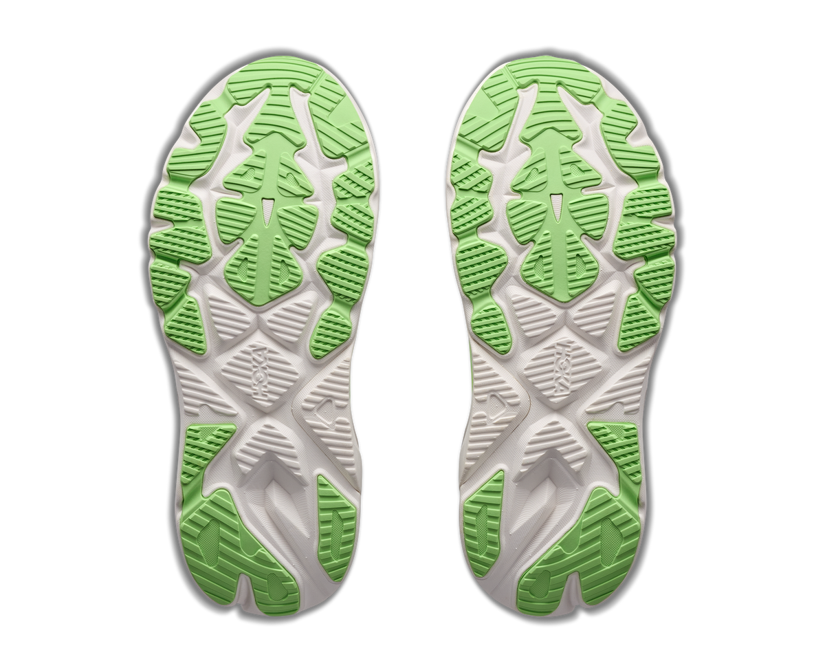 A pair of athletic shoes shown from the sole side, featuring a white and light gray textured tread pattern with bright green accents, isolated on a white background.
