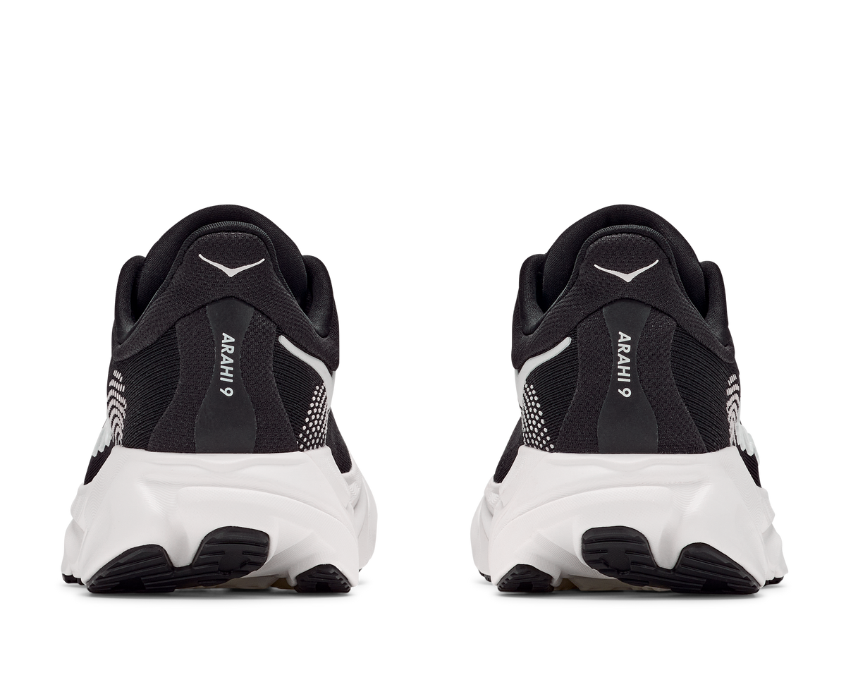 Black and white running shoes with 'Arahi' branding on a white background